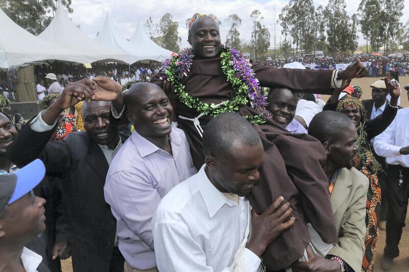 Peter Mokaya Tabichi is carried shoulder high after being installed as a Kisii elder by his clansmen at the Keriko Mixed Day Secondary School in Pwani Village of Njoro,  Nakuru County,  located 185 km from the capital city of Nairobi in Kenya on the 30th March 2019 during his home coming reception.  Tabichi won the Global teacher award last week. Photo/Fredrick Omondi/Kenya