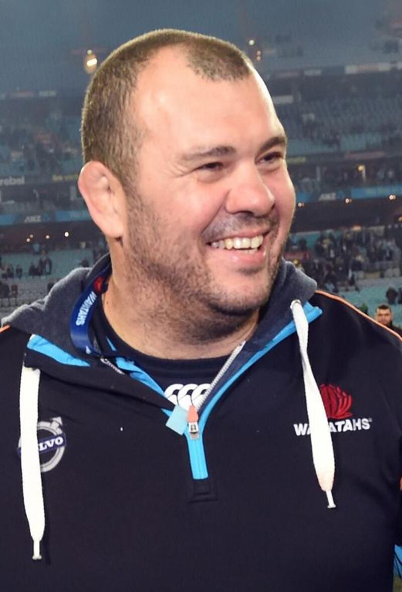 Michael Cheika, pictured in August 2, 2014 after coacing the New South Wales Waratahs past the Canterbury Crusaders in the Super 15 rugby union final in Sydney.  Now coaching the Australian national team, Cheika says Australia makes make its leagues 'so good that players don't want to leave, because they are enjoying themselves and getting what they want out of rugby". William West / AFP