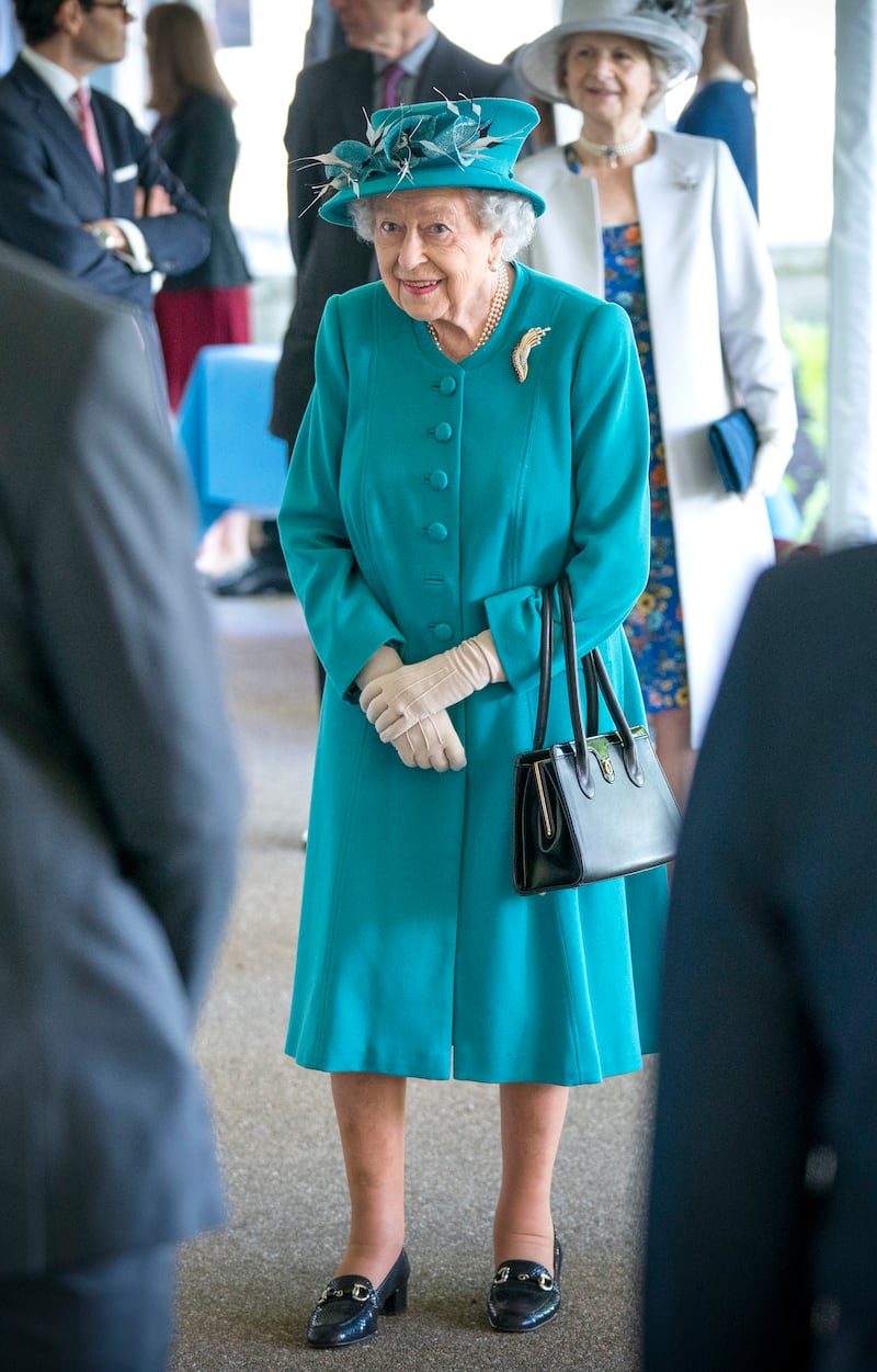 Queen Elizabeth II, wearing green, during a visit to the Edinburgh Climate Change Institute, as part of her traditional trip to Scotland for Holyrood Week on July 1, 2021, in Edinburgh. Getty Images