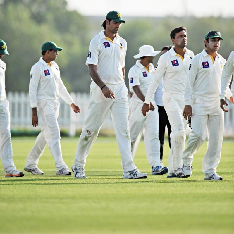 Mohammad Irfan, center, and Pakistan walk off the field after a practice match against the UAE in Abu Dhabi. Jeff Topping / For The National