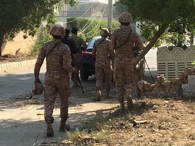 REFILE - CORRECTING TO CHINESE CONSULATE: Paramilitary forces and police are seen during an attack on the Chinese consulate, where blasts and shots are heard, in Karachi, Pakistan November 23, 2018. REUTERS/Akhtar Soomro