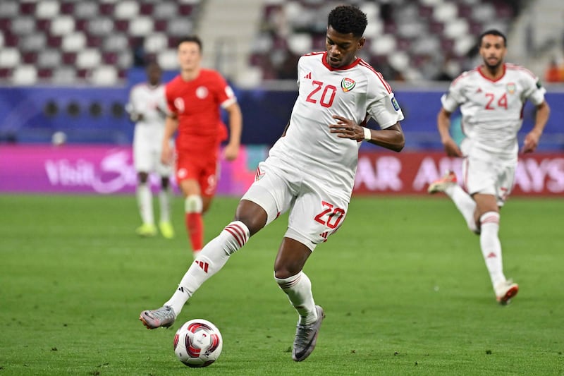 UAE forward Yahya al-Ghassani controls the ball during the Qatar 2023 AFC Asian Cup Group C football match between United Arab Emirates and Hong Kong. AFP