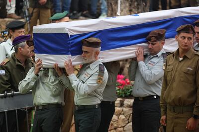 Israeli soldiers carry the coffin of Lt Col Tomer Grinberg, who was killed during fighting in the Gaza Strip. EPA