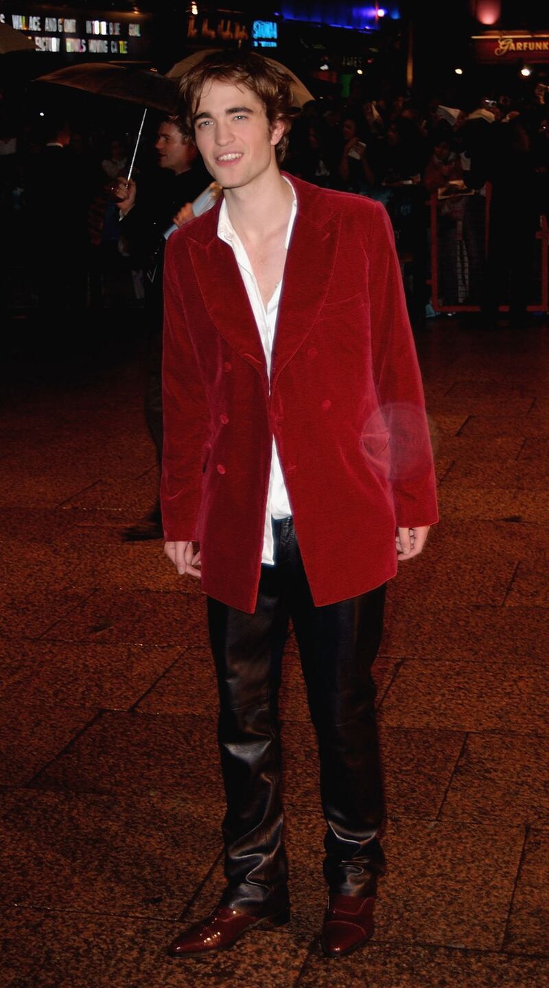 Robert Pattinson, in a red velvet jacket and leather trousers,  arrives at the world premiere of 'Harry Potter and the Goblet of Fire' in London on November 6, 2005. Getty Images