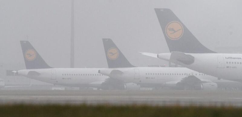 Lufthansa airplanes are seen in the fog at the airport in Munich, Germany, 24 November 2016. Numerous planes have been cancelled on the second day of the pilots' strike at Lufthansa. Stefan Puchner / EPA