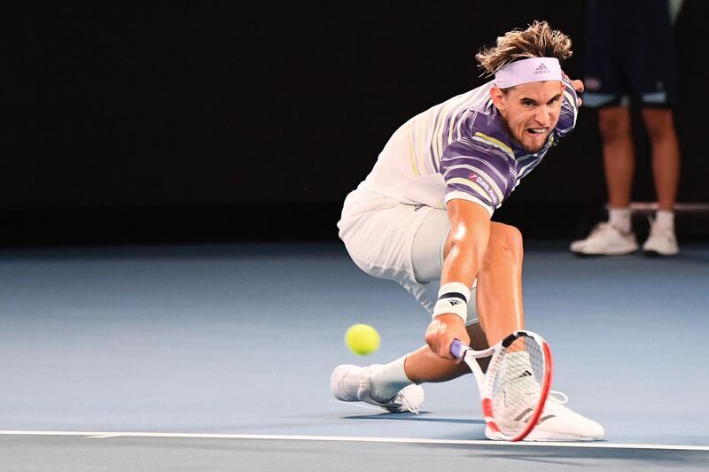 Austria's Dominic Thiem hits a return against Germany's Alexander Zverev during their men's singles semi-final match on day twelve of the Australian Open tennis tournament in Melbourne on January 31, 2020. IMAGE RESTRICTED TO EDITORIAL USE - STRICTLY NO COMMERCIAL USE
 / AFP / William WEST / IMAGE RESTRICTED TO EDITORIAL USE - STRICTLY NO COMMERCIAL USE
