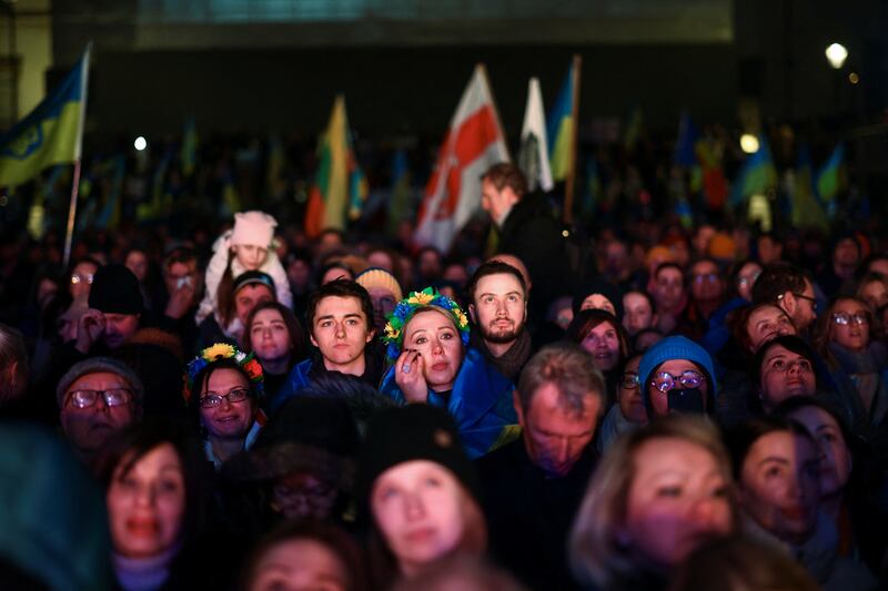 People attend the vigil at Trafalgar Square. Reuters