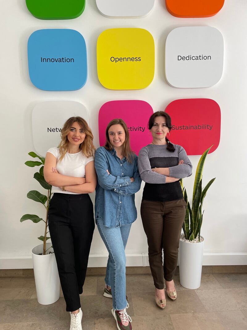 Alexandra Iliashenko (C) with her colleagues in Warsaw at the branch office that opened last month. Photo: Diia.Business