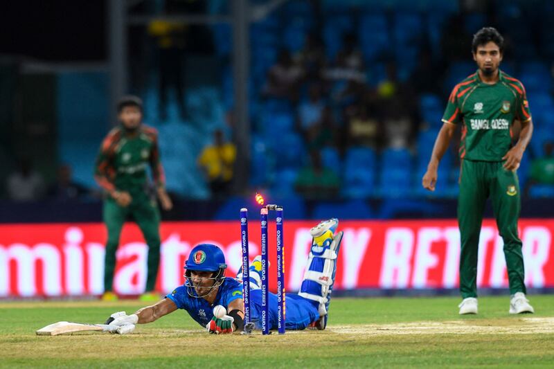 Rahmanullah Gurbaz survives an attempted run out during the T20 World Cup match between Afghanistan and Bangladesh. AFP