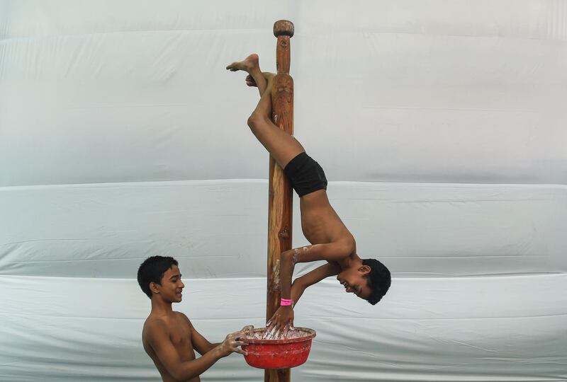 Young gymnasts train together. AFP