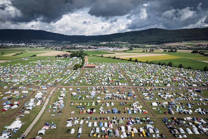 Car enthusiasts gather for the 18th world meeting of Citroen 2CV friends near Delemont, Switzerland. AFP