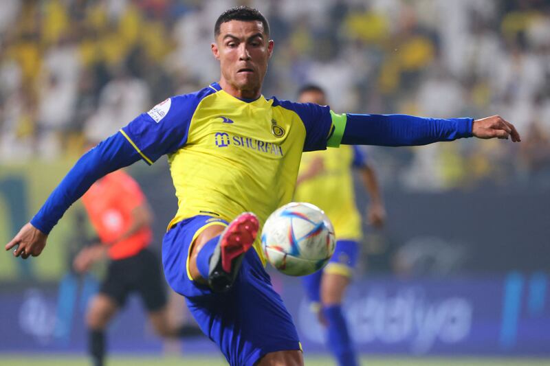 Cristiano Ronaldo controls the ball during the Saudi Pro League match between Al Nassr and Al Khaleej.