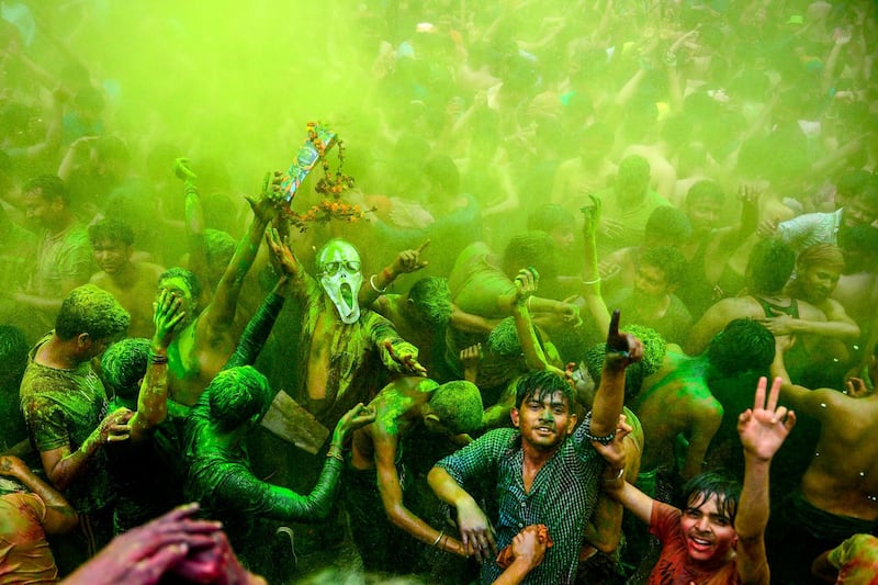 Revellers dance as they celebrate Holi, the spring festival of colours, in Allahabad, India.  AFP