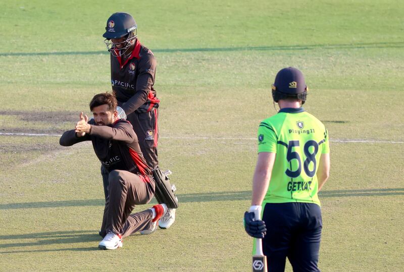 Rohan Mustafa of UAE celebrates a wicket against Ireland during the ICC World T20 Global Qualifiers at the Oman Cricket Academy Ground in Muscat. Subas Humagain for The National