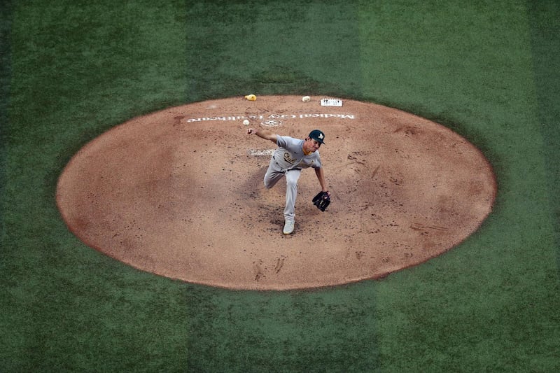 Chris Bassitt  of the Oakland Athletics throws against the Texas Rangers in the first inning at Globe Life Field on Saturday, September 12. Getty