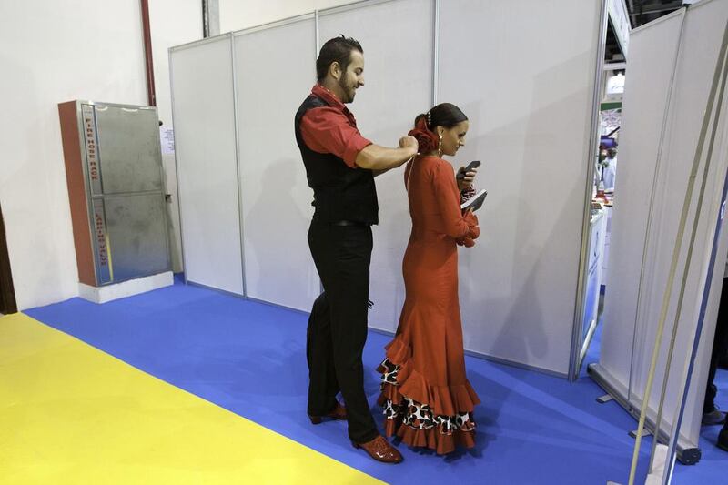 Spanish flamenco dancers prepare to perform during opening day of the Arabian Travel Market. Jaime Puebla / The National