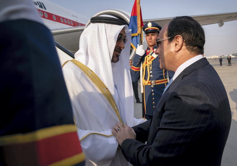 CAIRO, EGYPT - April 10, 2018: HH Sheikh Mohamed bin Zayed Al Nahyan Crown Prince of Abu Dhabi Deputy Supreme Commander of the UAE Armed Forces (L), received by HE Abdel Fattah El Sisi, President of Egypt (R), upon arrival at Cairo international Airport, commencing an official visit.

( Mohamed Al Hammadi / Crown Prince Court - Abu Dhabi )