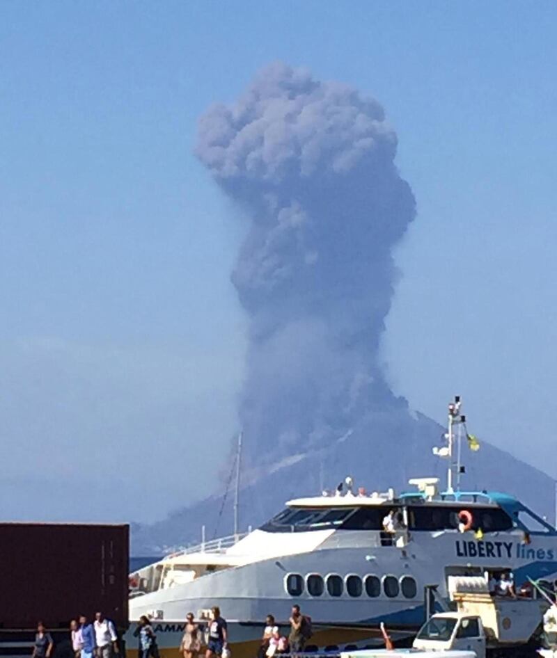 Ash rises into the sky after a volcano eruption on a small island of Stromboli, Italy.  According to reports, the island of Stromboli was hit by a set of violent volcano eruptions spurring beach tourists to take into the sea. Two new lava spouts are creeping down the volcano.  EPA