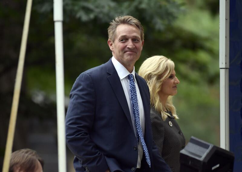 Senator Jeff Flake and his wife Cheryl Flake arrive to attend a memorial service for John McCain. AP Photo