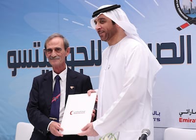 Panagiotis Theodoropoulos, President, Ju-Jitsu International Federation and Fahad Abdulrahman bin Sultan from UAE Red Crescent pose for photograph after signing a document in Abu Dhabi to train Jiu-Jitsu to refugees in Jordan. Ravindranath / The National 