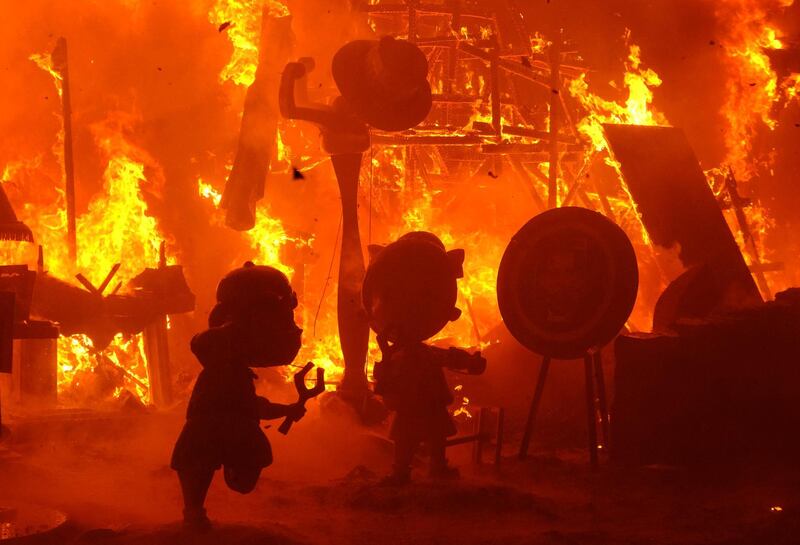 Figures that are part of a Fallas monument burn during the finale of the Fallas festival, in Valencia. Reuters