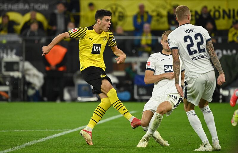 Dortmund's US midfielder Giovanni Reyna (L) scores the opening goal. AFP
