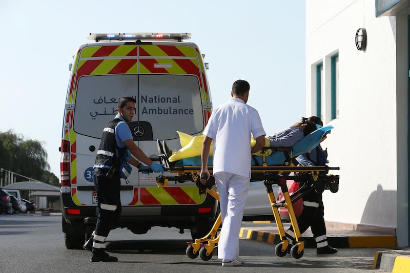 AJMAN , UNITED ARAB EMIRATES Ð Feb 24 , 2015 : May Glicerie Book ( right ) and Mohammad Rawashdeh ( left ) paramedic staff of National Ambulance brought car accident victim to Khalifa Hospital in Ajman. ( Pawan Singh / The National ) For News. Story by Jennifer Bell
 *** Local Caption ***  PS2402- AMBULANCE23.jpg