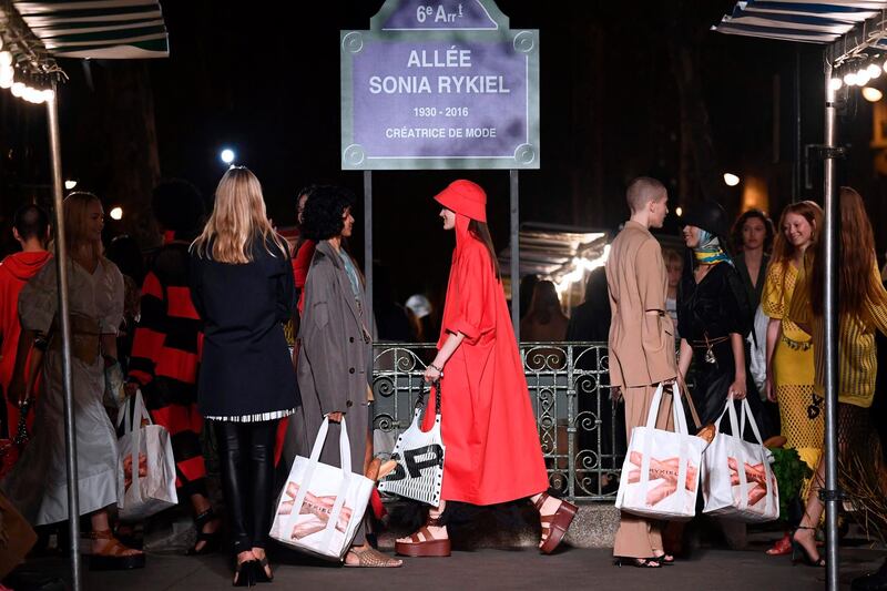 Models hold shopping bags at the end of the Sonia Rykiel Spring-Summer 2019 Ready-to-Wear collection fashion show in Paris. AFP