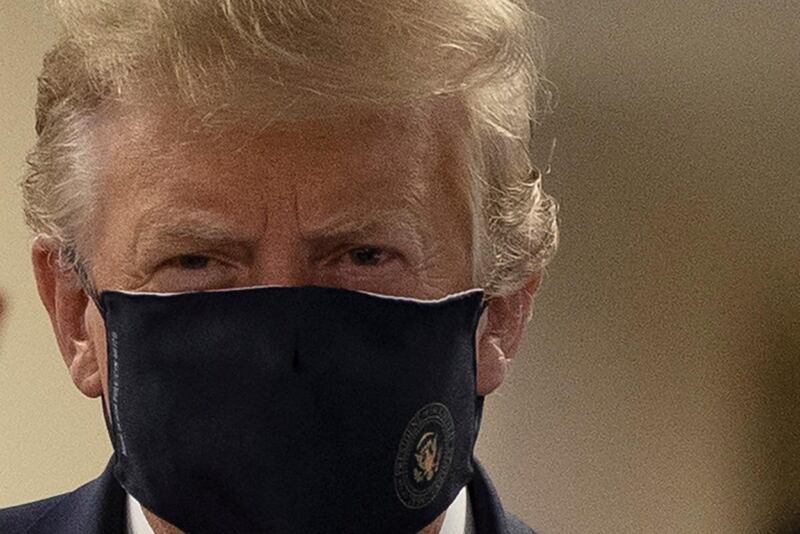 FILE PHOTO: U.S. President Donald Trump wears a mask while visiting Walter Reed National Military Medical Center in Bethesda, Maryland, U.S., July 11, 2020. REUTERS/Tasos Katopodis/File Photo