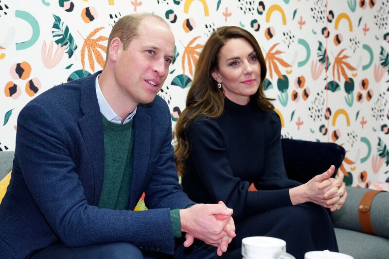 Britain's Kate, Princess of Wales, and Prince William listen to young adults in the 'Mentor Room' during a visit to the Open Door Charity, a charity focused on supporting young adults across Merseyside with their mental health, using culture and creativity as the catalyst for change in Birkenhead, England, Thursday, Jan.  12, 2023. AP