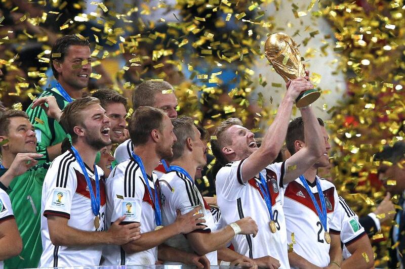 The German striker, Andre Schuerrle, above centre, celebrates with his teammates after Germany beat Argentina in the 2014 Fifa World Cup final on July 13. Adrian Dennis / AFP