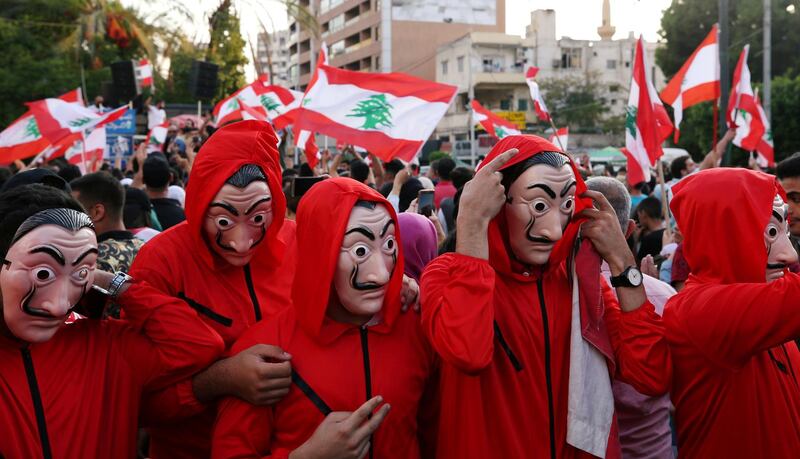 Demonstrators wearing costumes take part in an anti-government protest in Sidon, Lebanon. Reuters