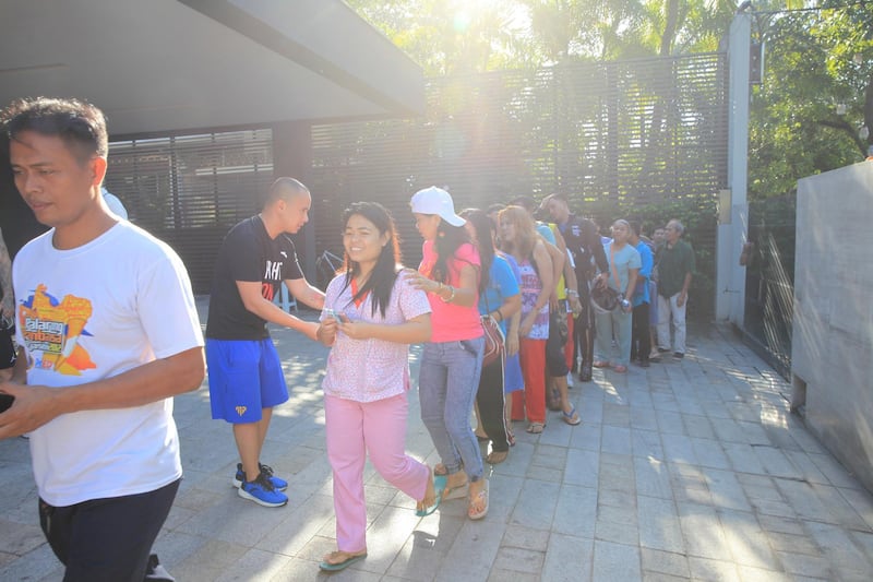 Fans and well-wishers line up in Manny Pacquiao's residence to receive "blessings" for Christmas. Each person receives one thousand pesos as a gift.