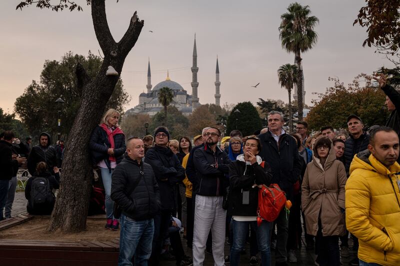 Tourists queue to enter the Hagia Sophia mosque in Istanbul