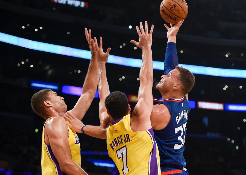 Oct 19, 2017; Los Angeles, CA, USA; LA Clippers forward Blake Griffin (32) attempts a shot defended by Los Angeles Lakers forward Larry Nance Jr. (7) and center Brook Lopez (11) during the first half at Staples Center. Mandatory Credit: Kelvin Kuo-USA TODAY Sports