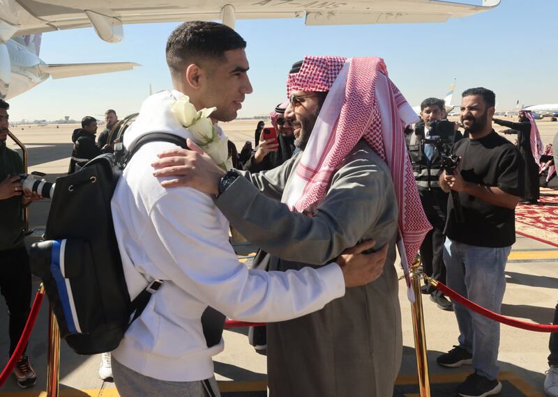 PSG's Achraf Hakimi is welcomed upon arrival. Reuters