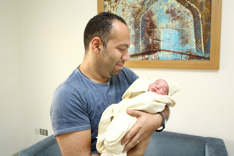 Baby Danial with his father, Ramez Nabil, at Burjeel Hospital in Abu Dhabi. Danial was born at 12.01am on Tuesday. Courtesy: Mounir family