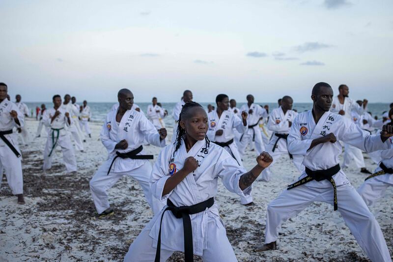 Athletes perform at a beach exhibition before the Mombasa Open Tong-IL Moo-Doo International Martial Arts Championship 2022, in Kenya. AFP