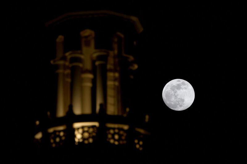 The full moon rises over Dubai. It was the second of two supermoons this year. AFP