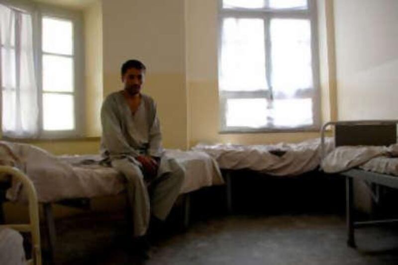 A patient sits alone in a room at Afghanistan's only mental health facility, the Psychiatric and Drug Dependency Treatment Hospital in Kabul.