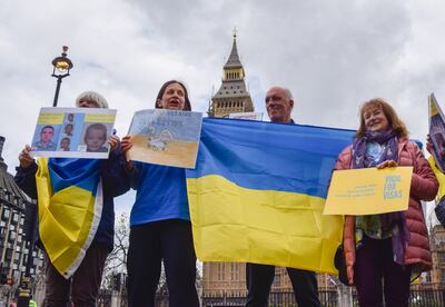 Protesters outside the British Parliament demonstrate against delays to visas being issued to Ukrainian refugees. Reuters

