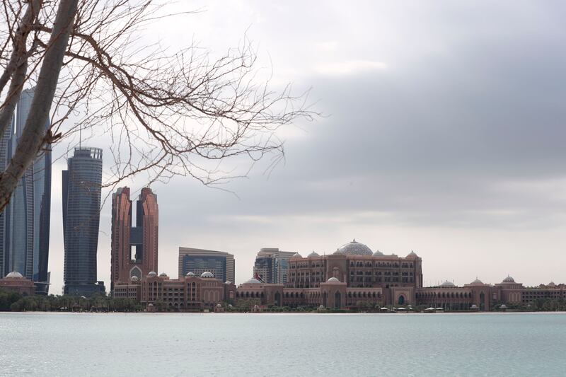 Dark clouds gather over Emirates Palace in Abu Dhabi. Khushnum Bhandari / The National