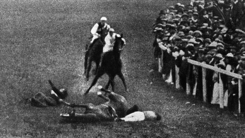 1913, Epsom, Surrey, England, UK --- Suffragette Emily Davison is hit and killed by King George V's horse Anmer during the 1913 Epsom Derby. She fell underneath the galloping horse after leaping from the crowd and trying to grab hold the reins. --- Image by © Hulton-Deutsch Collection/CORBIS