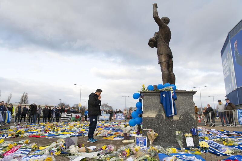 Cardiff City CEO Ken Choo visits tributes to Emiliano Sala at the Cardiff City Stadium in Wales. Getty