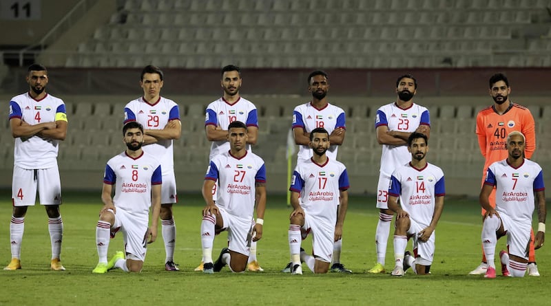 Sharjah's players pose for a group picture ahead of the AFC Champions League group B match between UAE's Sharjah FC and Uzbekistan's Pakhtakor at the Sharjah football stadium. AFP