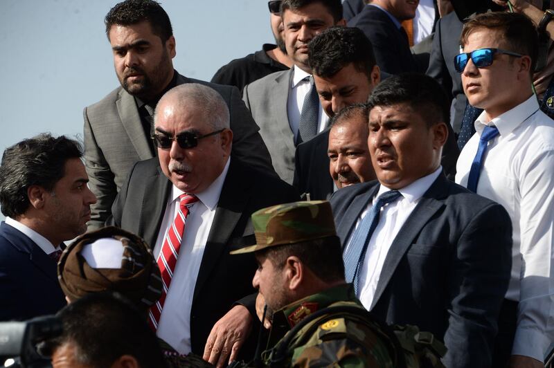 In this photo taken on July 22, 2018, Afghan Vice President Abdul Rashid Dostum (2nd R) arrives at Hamid Karzai International Airport in Kabul. The death toll from a suicide attack near Kabul international airport has risen to 23, the health ministry said July 23, with an AFP driver among the dead. At least 107 others were wounded in the powerful explosion on July 22, which happened as scores of people were leaving the airport after welcoming home Afghan Vice President Abdul Rashid Dostum from exile.

 / AFP / NOORULLAH SHIRZADA
