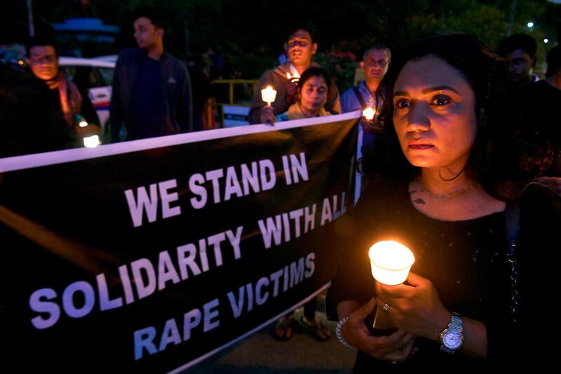 People hold a candlelight vigil in support of sexual assault victims and against the alleged rape and murder of a 27-year-old veterinary doctor in Hyderabad, in Bangalore. AFP