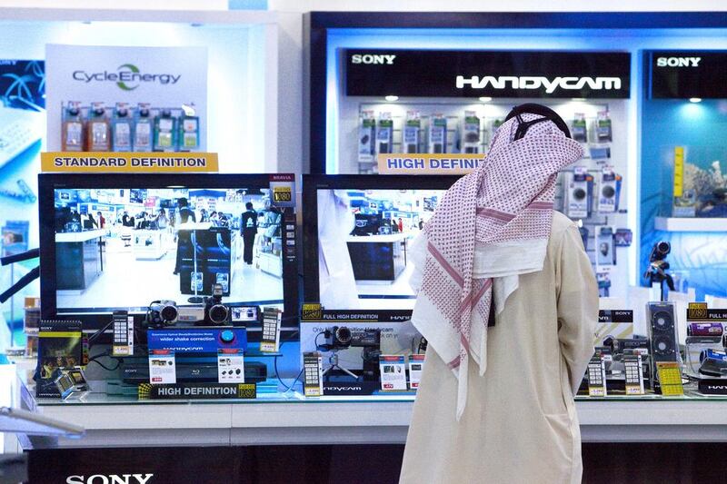A man check electronics gadgets at Jumbo Electronics store in Mall of the Emirates during the Christmas season. Jumbo Electronics recently invested US$1m into its online retailing. Jaime Puebla / The National