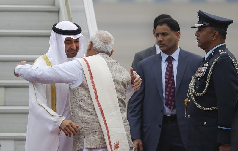 Sheikh Mohammed bin Zayed, Crown Prince of Abu Dhabi and Deputy Supreme Commander of the Armed Forces, embraces the Indian prime minister Narendra Modi upon his arrival at the airport in New Delhi. Sheikh Mohammed will be India's chief guest at Thursday's Republic Day celebrations. Manish Swarup / AP Photo