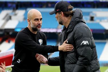 Soccer Football - Premier League - Manchester City v Liverpool - Etihad Stadium, Manchester, Britain - April 10, 2022 Manchester City manager Pep Guardiola with Liverpool manager Juergen Klopp after the match Action Images via Reuters/Carl Recine EDITORIAL USE ONLY.  No use with unauthorized audio, video, data, fixture lists, club/league logos or 'live' services.  Online in-match use limited to 75 images, no video emulation.  No use in betting, games or single club /league/player publications.   Please contact your account representative for further details. 